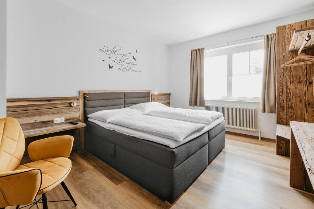 A bed or beds in a room at Jacky's Mühle