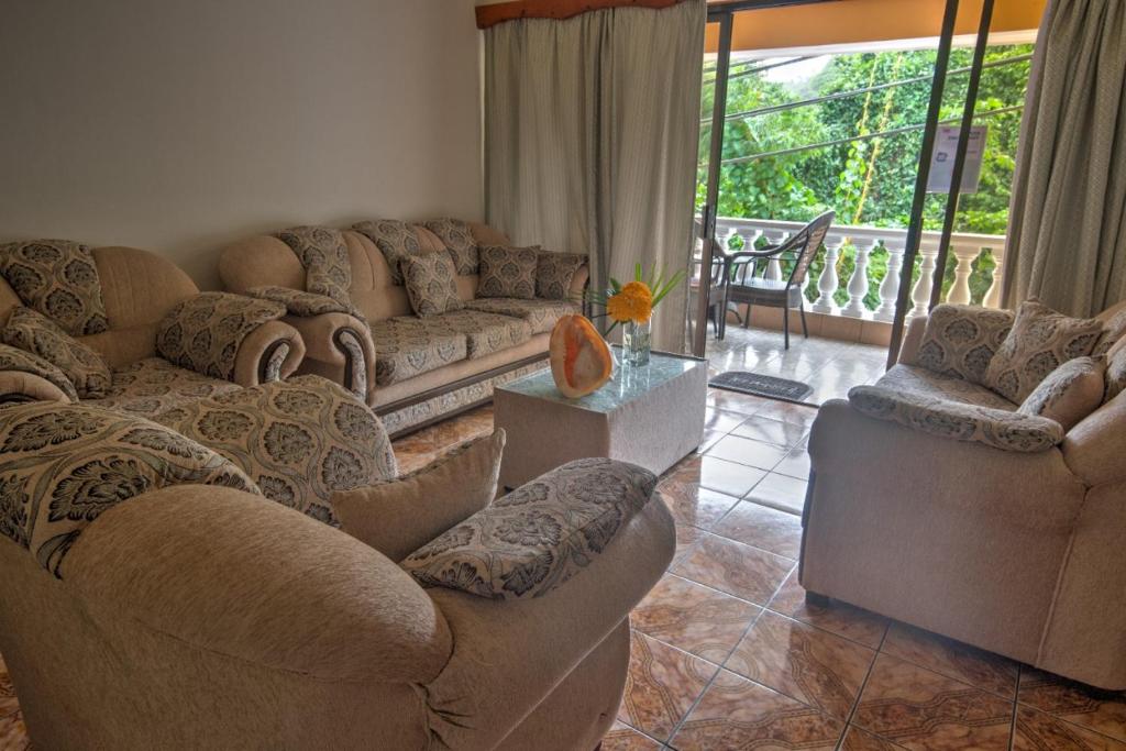 Posezení v ubytování Pascalo Villa Apartment