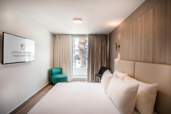 Postel nebo postele na pokoji v ubytování Astral Palma Hotel