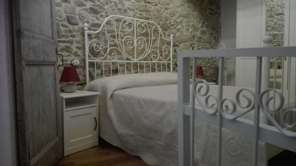 Postel nebo postele na pokoji v ubytování Agriturismo Nonnamelia