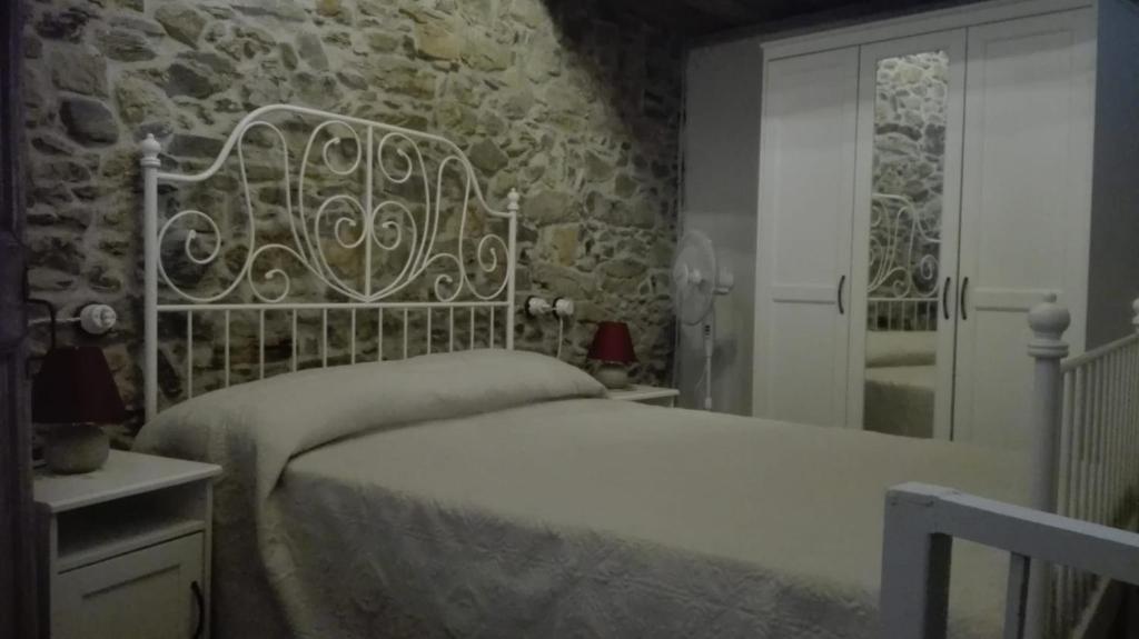 Postel nebo postele na pokoji v ubytování Agriturismo Nonnamelia