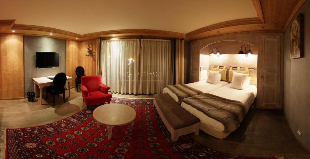 Postel nebo postele na pokoji v ubytování Hôtel Alpina & SPA - Restaurant Oxalis