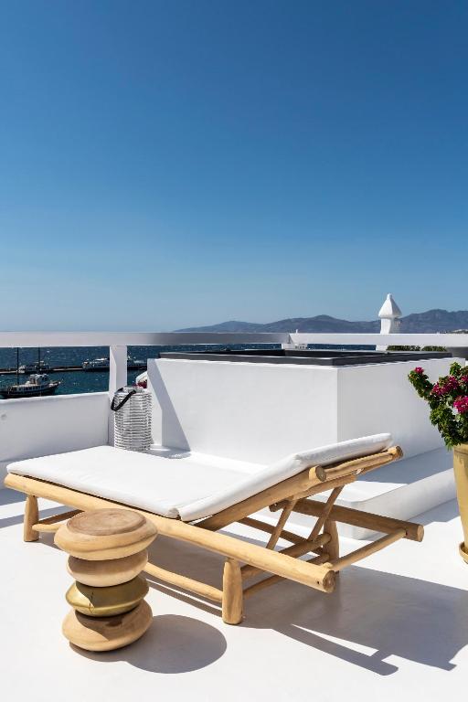 a table on the deck of a boat at The TownHouse Mykonos in Mýkonos City
