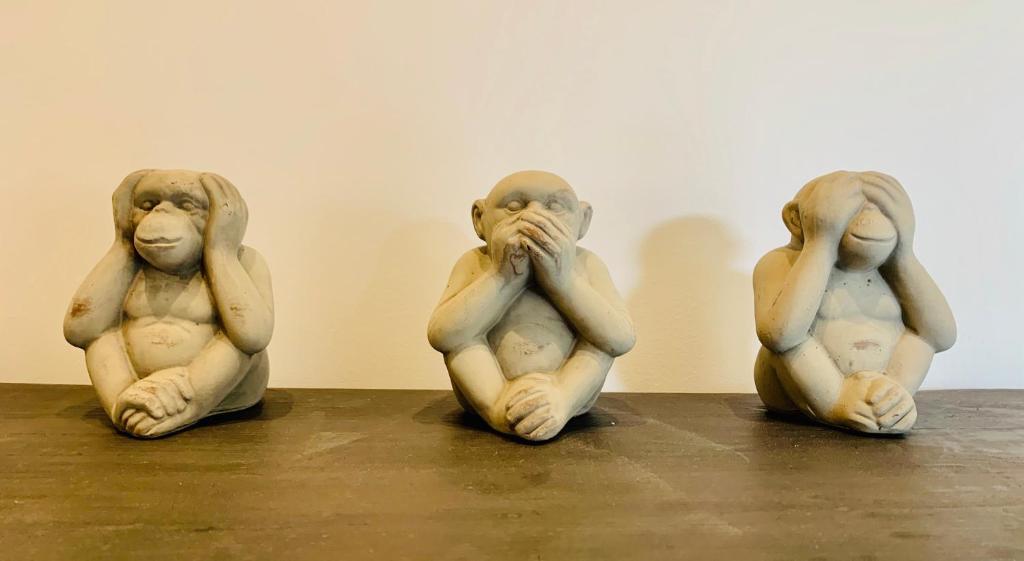 a group of three figurines sitting on a table at LE TROIS B in Beaune