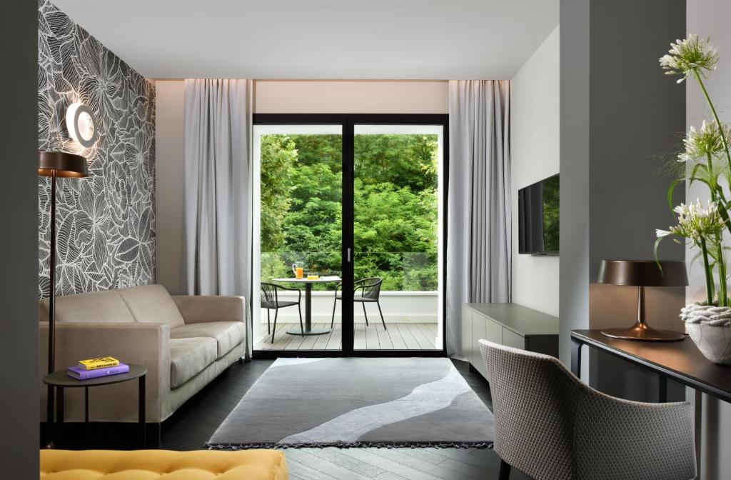 Televiisor ja/või meelelahutuskeskus majutusasutuses Bianca Relais, by R Collection Hotels