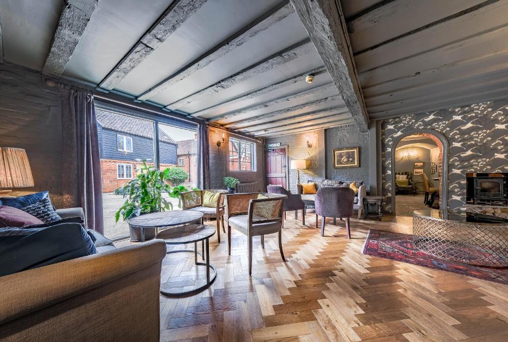 a living room with a couch and a table at The Westleton Crown in Westleton