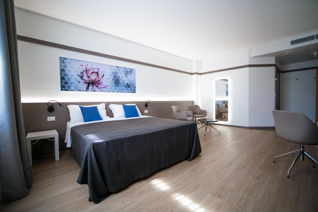 Postel nebo postele na pokoji v ubytování Bonotto Hotel Palladio
