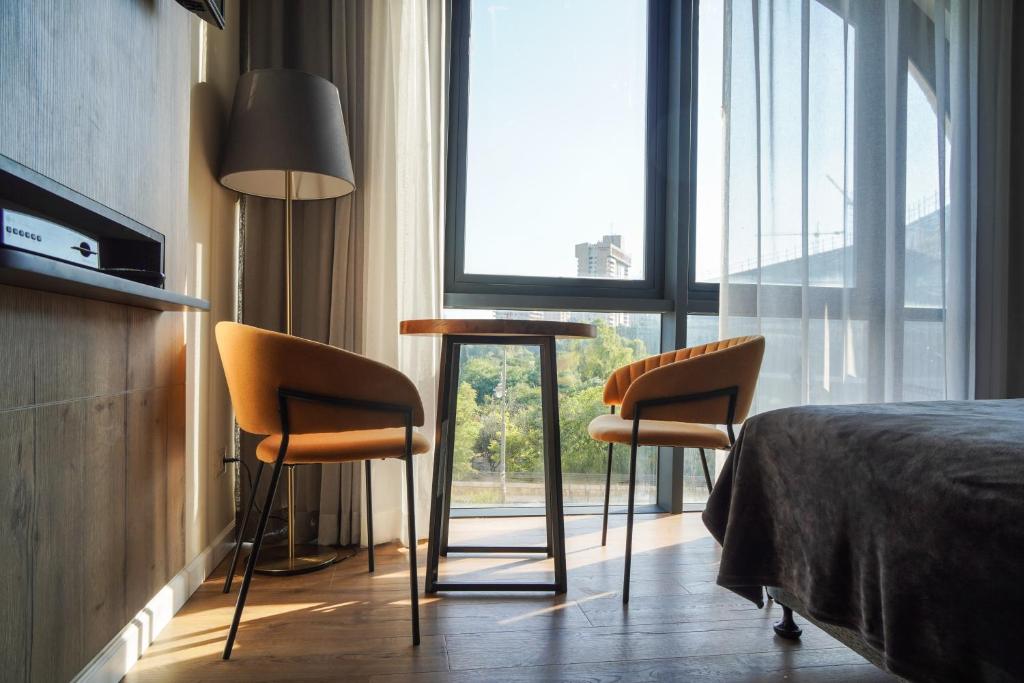 Postel nebo postele na pokoji v ubytování Apartique Hotel