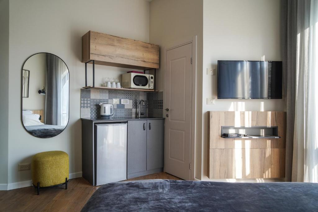 Kuchyň nebo kuchyňský kout v ubytování Apartique Hotel