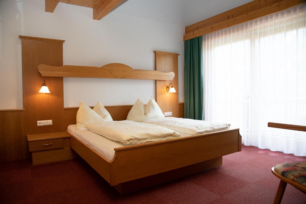 Postel nebo postele na pokoji v ubytování Erlebnishotel Kärnten-Mölltal 3 Stern Superior