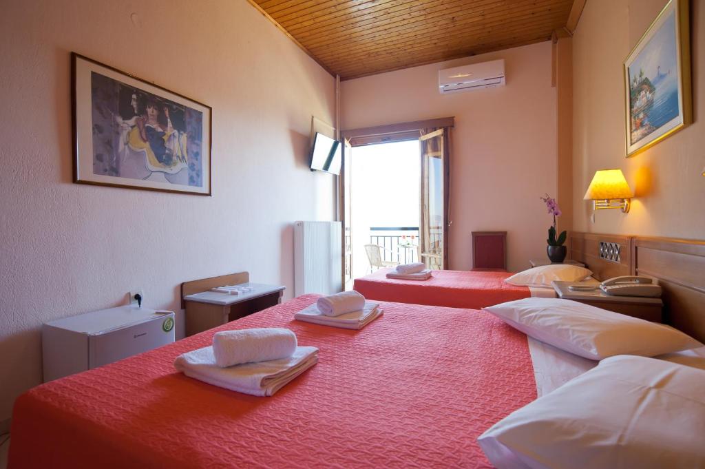 Posteľ alebo postele v izbe v ubytovaní Acropole Delphi City Hotel