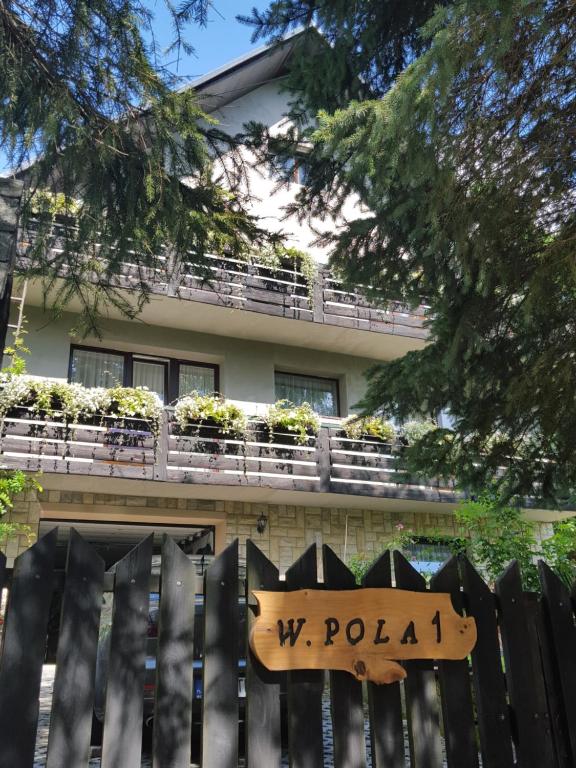 a building with a sign that reads w polka at Pokoje Gościnne u Gochy in Ustrzyki Dolne