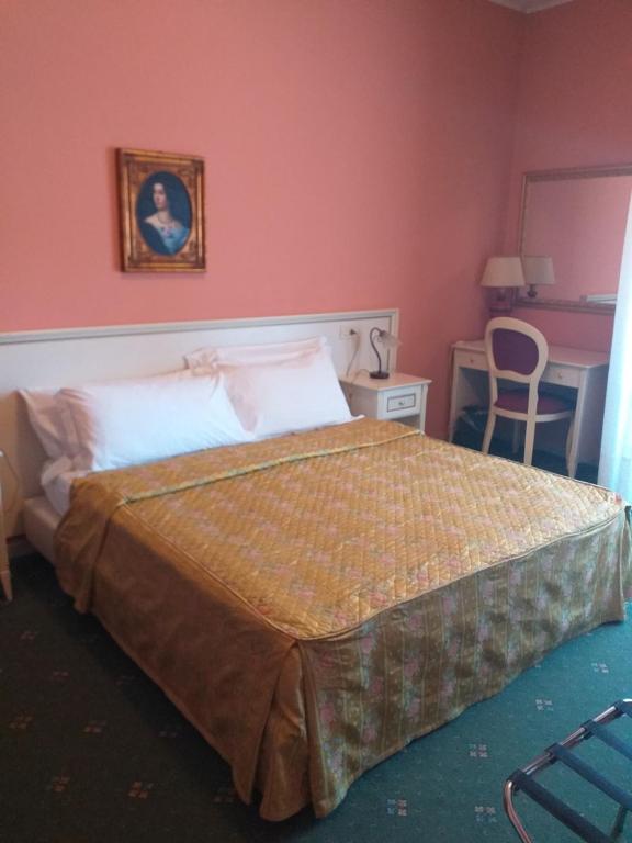 Postel nebo postele na pokoji v ubytování Hotel Monna Lisa