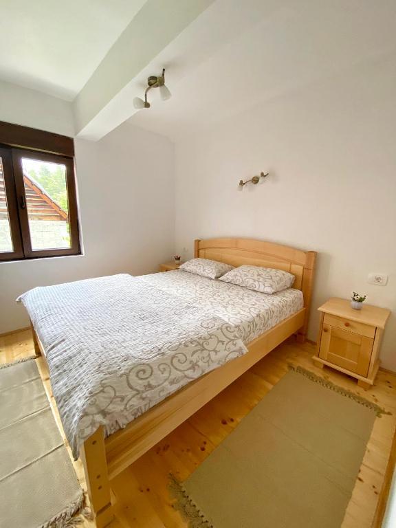 Postel nebo postele na pokoji v ubytování Apartments Vuković