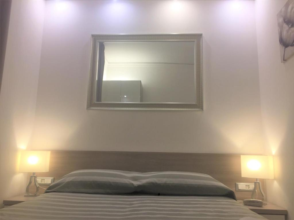 Postel nebo postele na pokoji v ubytování Hotel Alinari