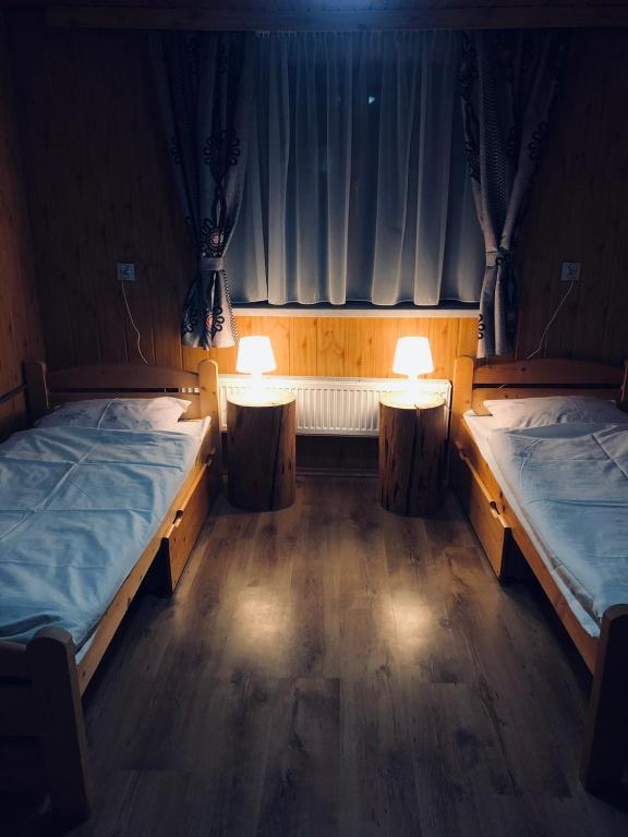 Postel nebo postele na pokoji v ubytování Domek w Górach