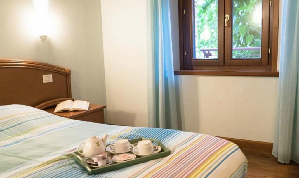 Postel nebo postele na pokoji v ubytování Agriturismo Fogolar da Capo