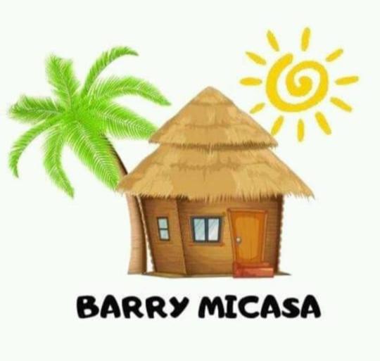 a straw hut with a palm tree and a happy message at BARRY MICASA SELF CATERING ACCOMMODATION in Port Elizabeth