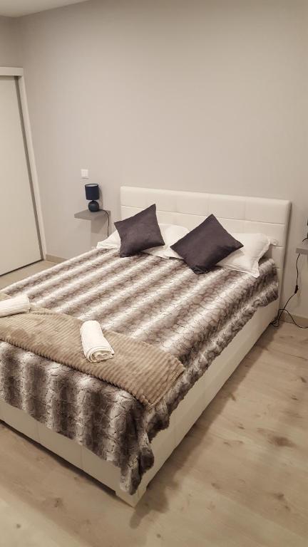 Ένα ή περισσότερα κρεβάτια σε δωμάτιο στο Vila Magna Albufeira