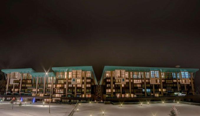 a row of apartment buildings at night with lights at Silver Mountain G1 43 in Poiana Brasov