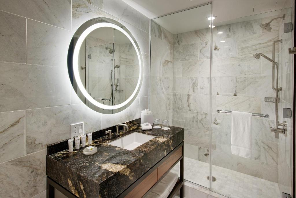 
a bathroom with a large mirror and a bath tub at InterContinental San Francisco, an IHG Hotel in San Francisco
