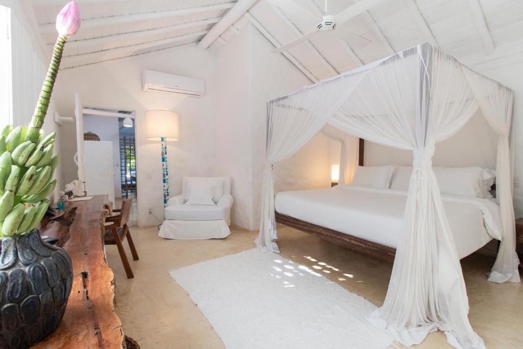Postel nebo postele na pokoji v ubytování UXUA Casa Hotel & Spa