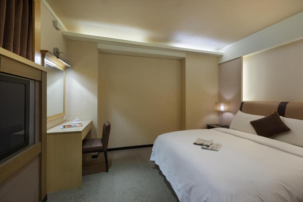 Postel nebo postele na pokoji v ubytování K Hotel Keelung