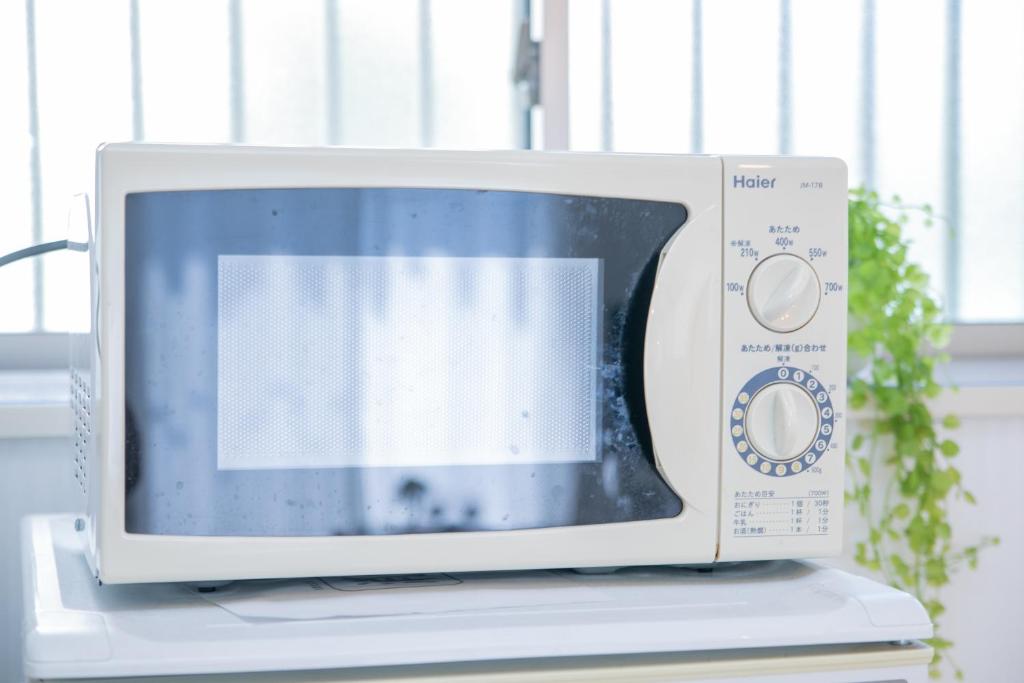 TV a/nebo společenská místnost v ubytování Yokkaichi Hazunaka Hotel
