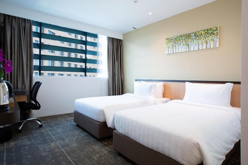 Postel nebo postele na pokoji v ubytování Hotel 7 Suria