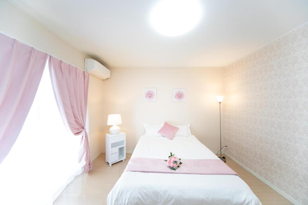 Postel nebo postele na pokoji v ubytování Yokkaichi Hazunaka Hotel