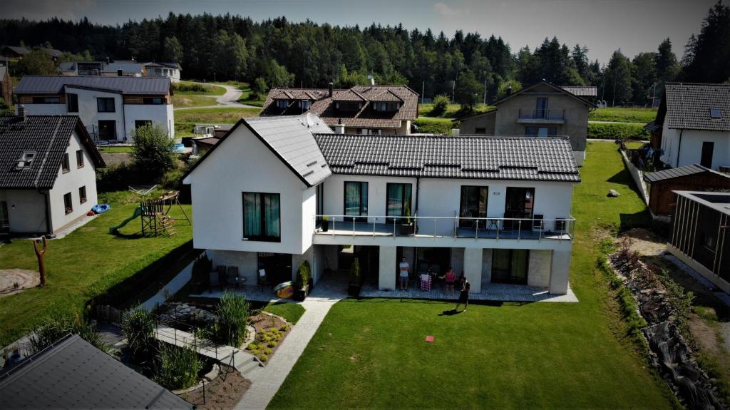 an aerial view of a house in a village at Apartmany 154 in Lipno nad Vltavou