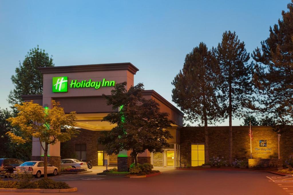 a holiday inn sign on the front of a building at Holiday Inn Portland-Airport I-205 by IHG in Portland