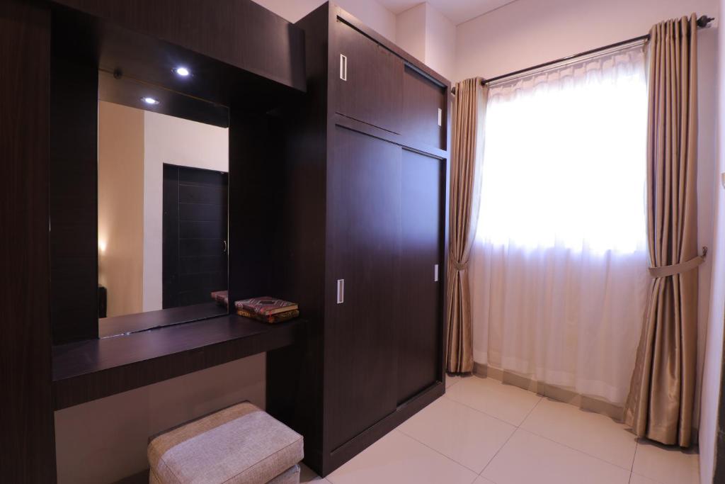Postel nebo postele na pokoji v ubytování Saka Hotel Medan