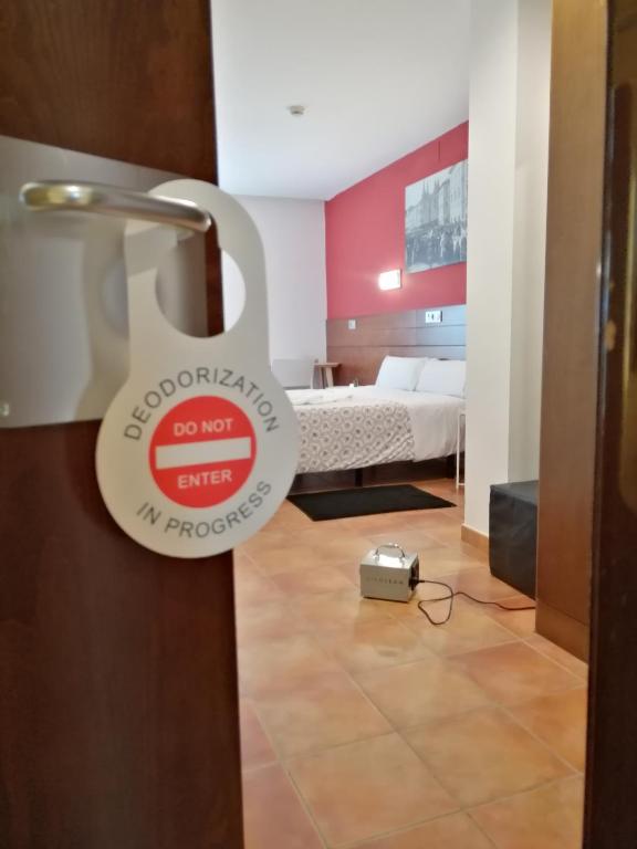 Posteľ alebo postele v izbe v ubytovaní Hotel Cuéntame