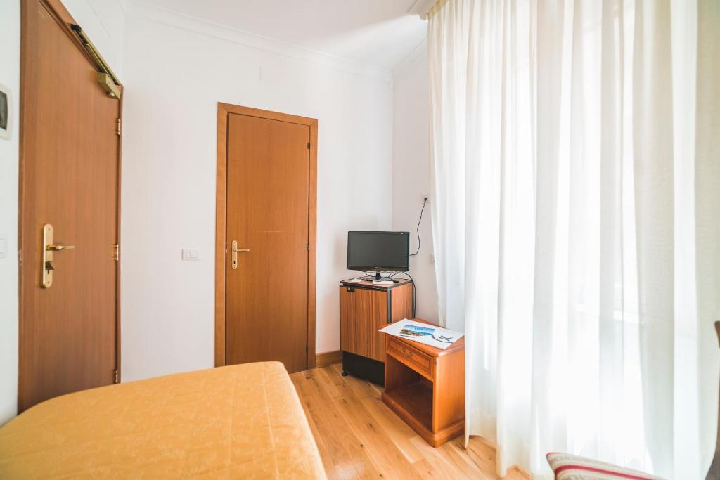 TV a/nebo společenská místnost v ubytování GH Hotel San Giusto