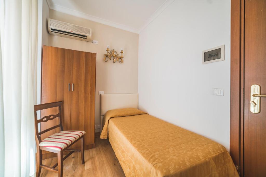 Postel nebo postele na pokoji v ubytování GH Hotel San Giusto