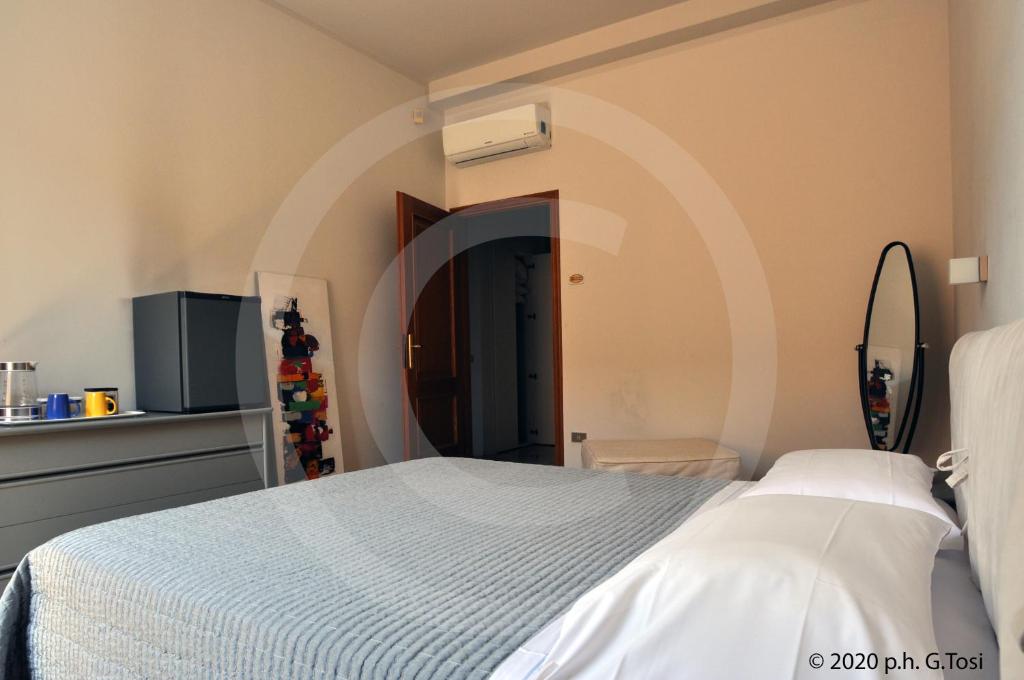 Postel nebo postele na pokoji v ubytování A.A.A. Armonie B&B