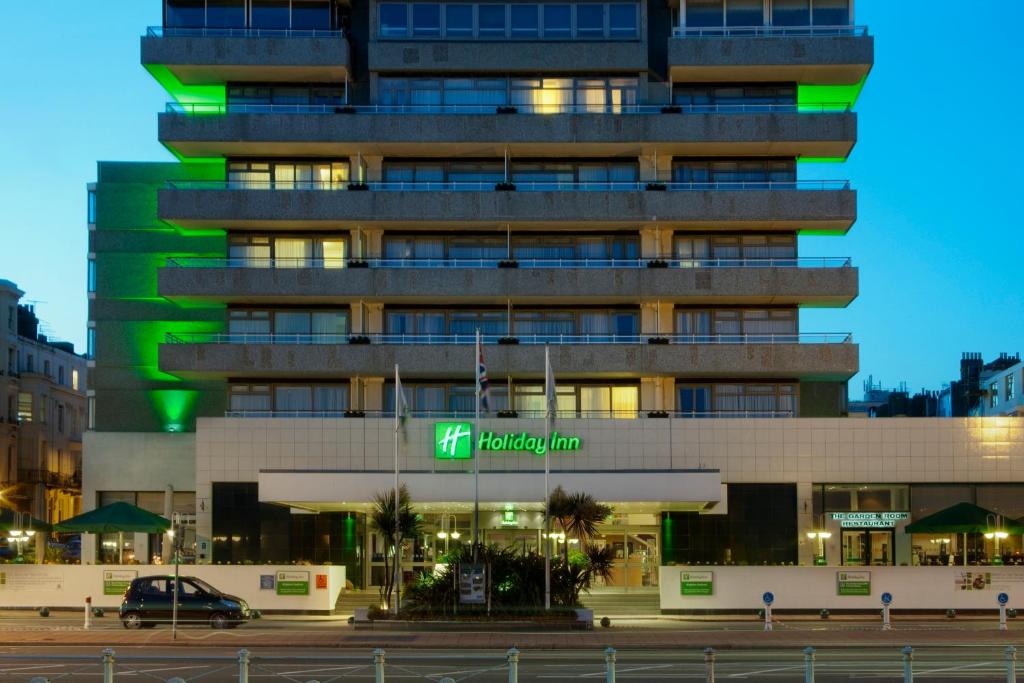 a large building with a traffic light on top of it at Holiday Inn Brighton Seafront, an IHG Hotel in Brighton & Hove
