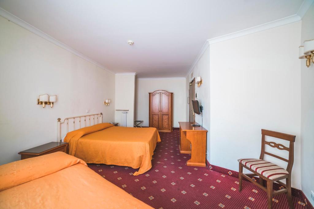 Postel nebo postele na pokoji v ubytování GH Hotel San Giusto