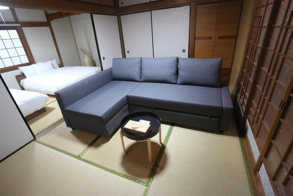 Postel nebo postele na pokoji v ubytování かわもと別邸９２６