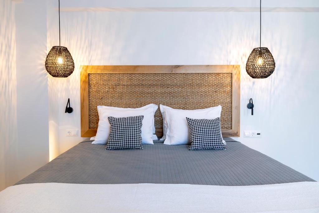 Postel nebo postele na pokoji v ubytování La Stella Suites