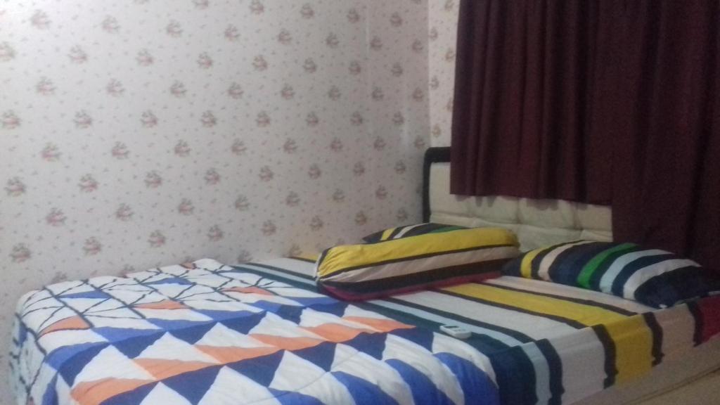 Postel nebo postele na pokoji v ubytování Mayestik Guest House Syariah