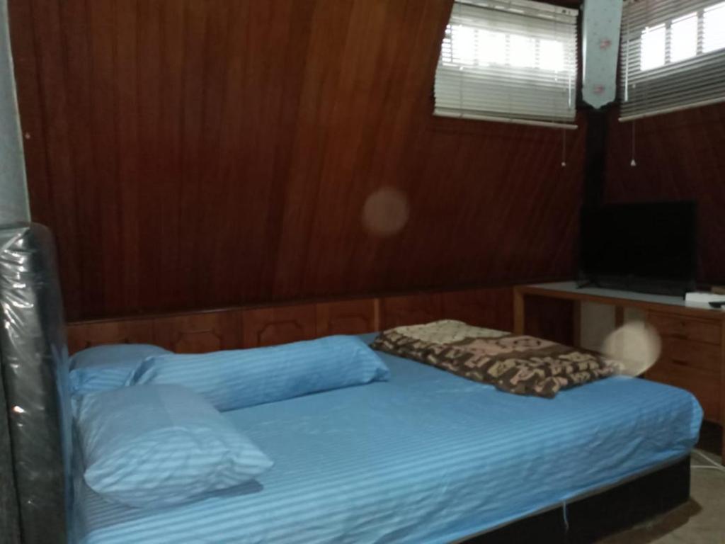 Postel nebo postele na pokoji v ubytování Mayestik Guest House Syariah