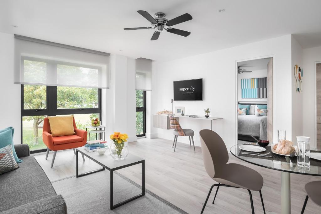 a living room with a couch and a table at Q Square by Supercity Aparthotels in Brighton & Hove
