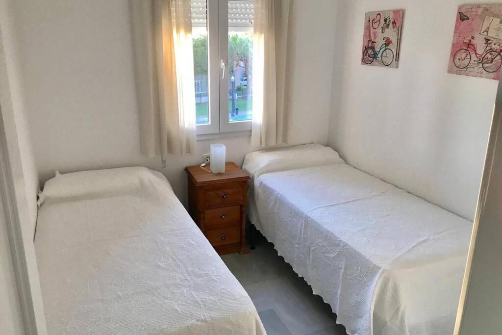 Posteľ alebo postele v izbe v ubytovaní Precioso apartamento muy cerca de la playa
