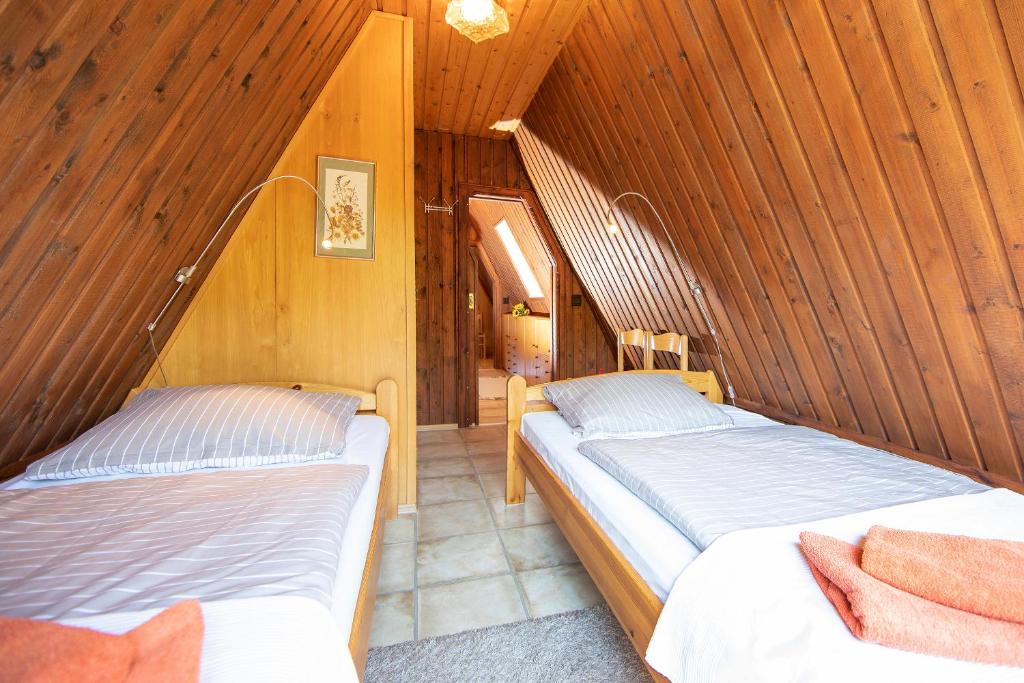 Postel nebo postele na pokoji v ubytování Das DÜNENHAUS
