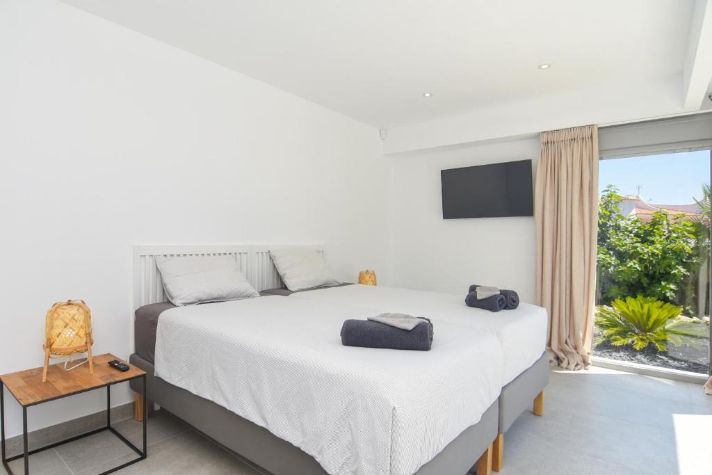Posteľ alebo postele v izbe v ubytovaní Graham Holiday Rentals - Les Bassetes