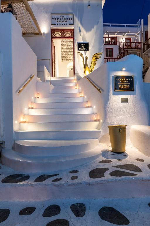 a set of stairs with lights in a building at The TownHouse Mykonos in Mýkonos City