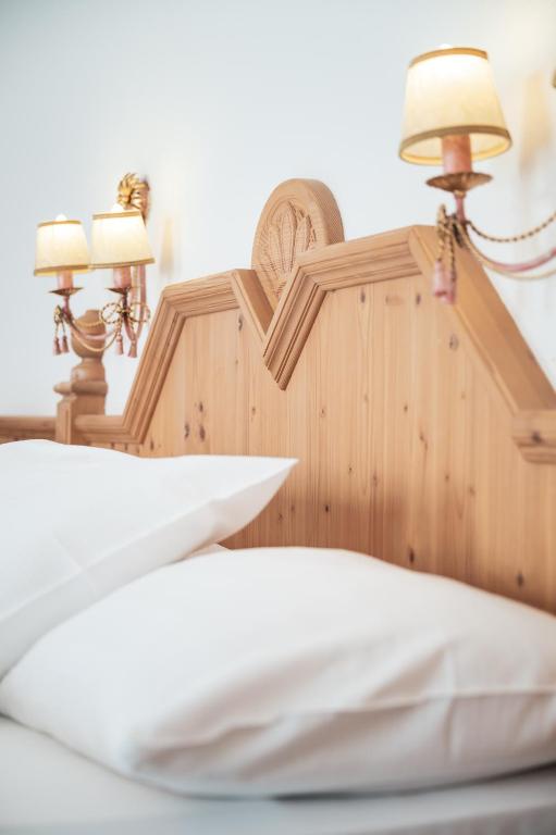 Posteľ alebo postele v izbe v ubytovaní Hotel Chalet Corso