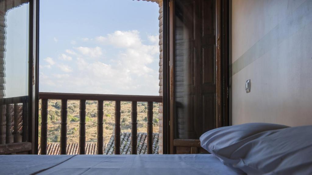 Posteľ alebo postele v izbe v ubytovaní San Cipriano con parking incluido - Apartamentos Aloha Toledo